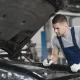 Car repair shop composition with mechanic tools