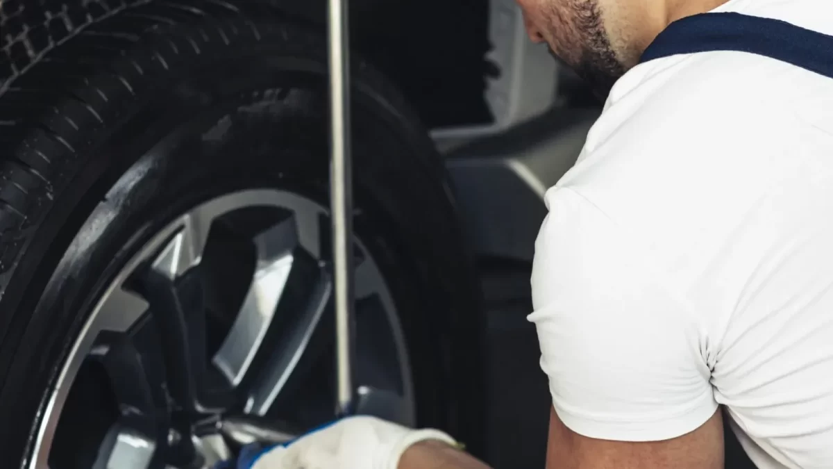 Mechanic fixing a car wheel