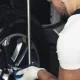 Mechanic fixing a car wheel
