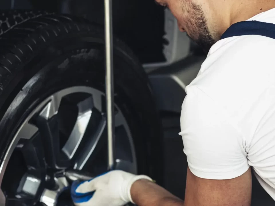 Mechanic fixing a car wheel