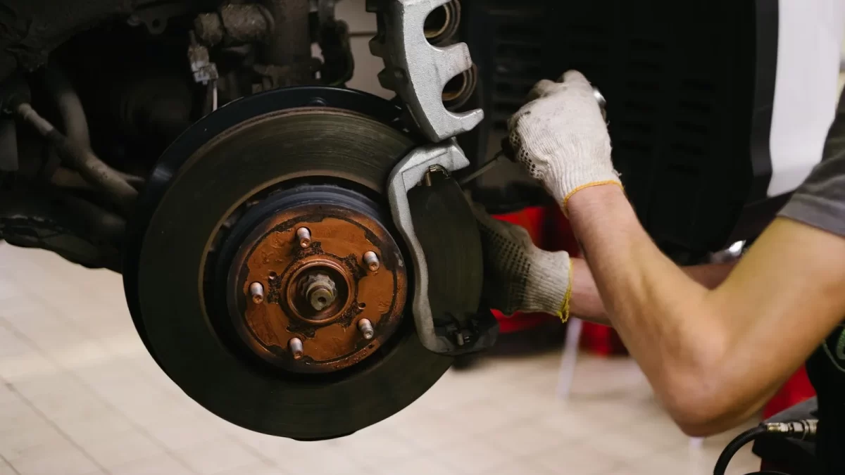 Mechanic working on a car in a garage