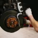 Mechanic working on a car in a garage
