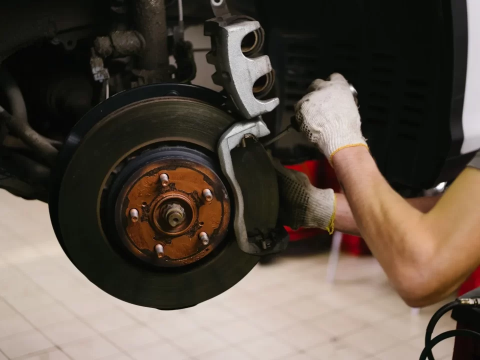 Mechanic working on a car in a garage